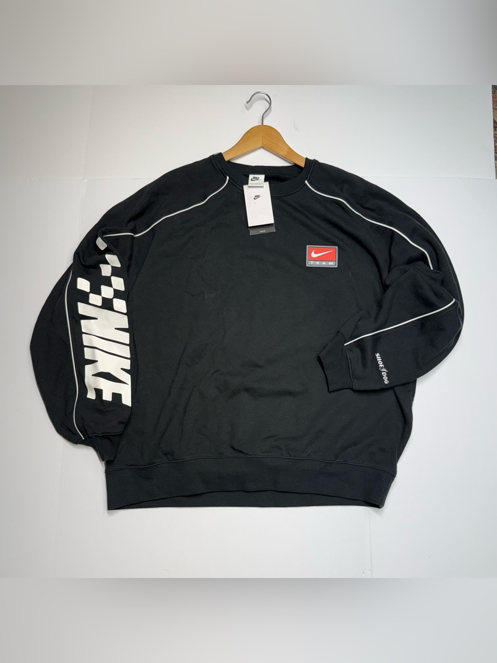 Nike Black Crewneck Sweatshirt with White Sleeve Logo and Red Patch